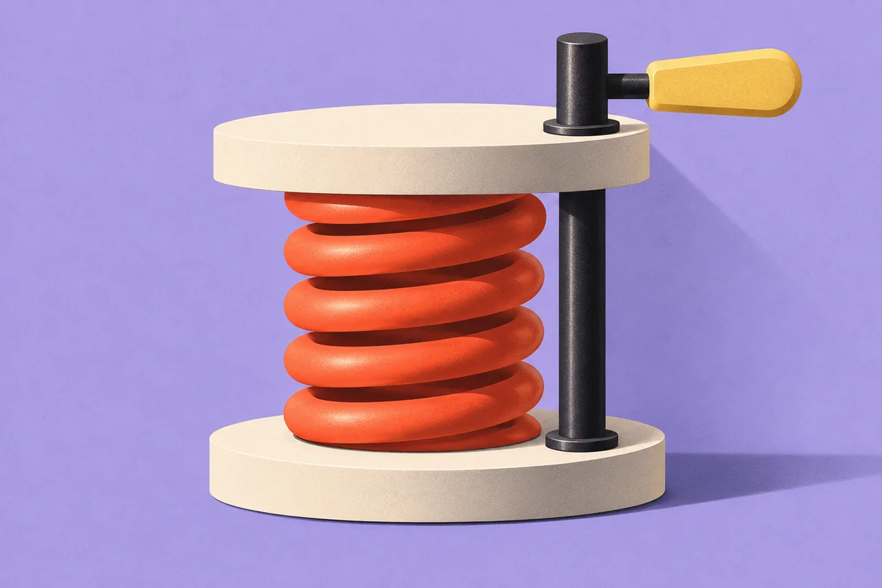 A black retaining pin holds a coral spring between two ivory plates